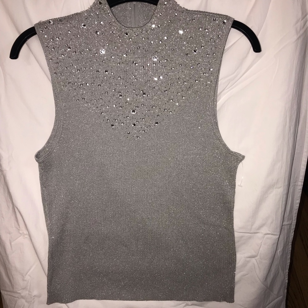 Silver knit with beaded collar embellishment.